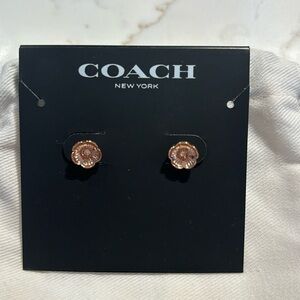 Coach rose gold flower earrings, never worn with pouch included.